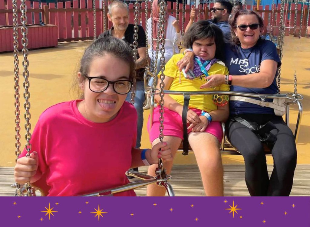 Maddi with her friend Jon and his parents on a merry-go-round.